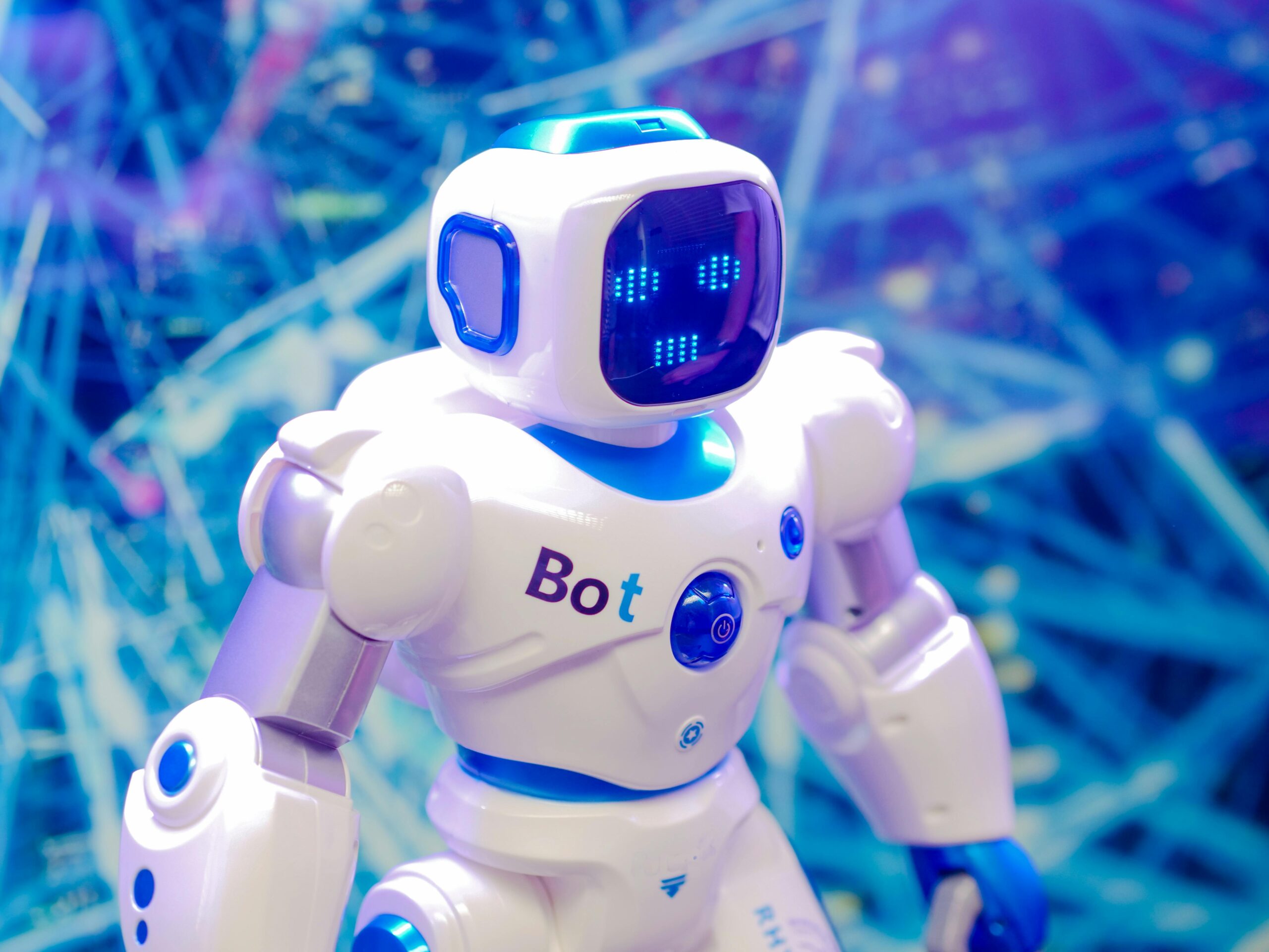 High-tech humanoid robot with LED face display, showcasing modern robotics and innovation.